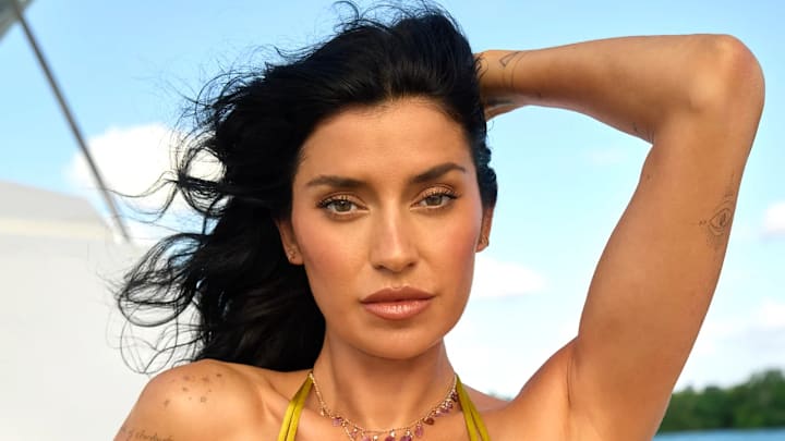 Nicole Williams English was photographed by Yu Tsai in Jamaica. Swimsuit by Indah. Necklaces by Jacquie Aiche and Ettika