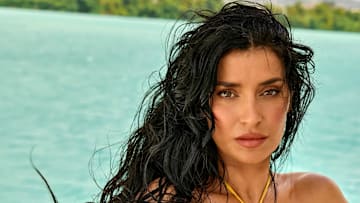 Nicole Williams English was photographed by Yu Tsai in Jamaica. Swimsuit by Tropic of C.