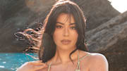Lauren Chan was photographed by Ben Watts in Bermuda. Swimsuit by Cult Gaia. Bracelets by Alexis Bittar.