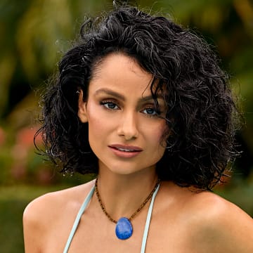 Nazanin Mandi was photographed by Yu Tsai in Jamaica. Swimsuit by Bad N Bare. Necklace by Eric Silva.