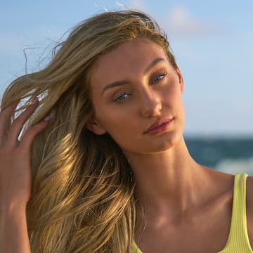 Cameron Brink was photographed by Ben Horton at The Boca Raton. Swimsuit by Andi Bagus. Swimsuit embroidered by Abbode.