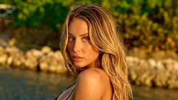 Alix Earle was photographed by Yu Tsai in Jamaica. Swimsuit by Lybethras. Body Chain by Jacquie Aiche.
