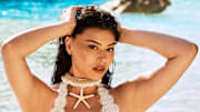 Lauren Chan was photographed by Ben Watts in Bermuda. Swimsuit by PQ Swim. Necklace by Andi Bagus.