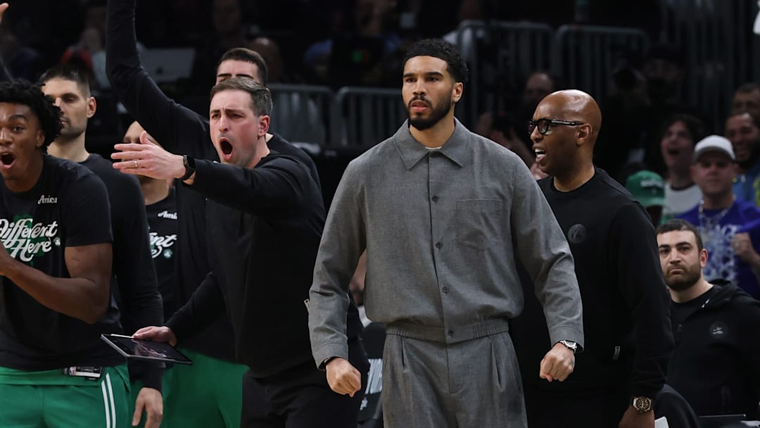 May 2, 2026; Boston, Massachusetts, USA; Boston Celtics forward Jayson Tatum (0) and the rest of the Celtics bench react to a three point basket against the Philadelphia 76ers during the second quarter of game seven of the first round of the 2026 NBA Playoffs at TD Garden. 
