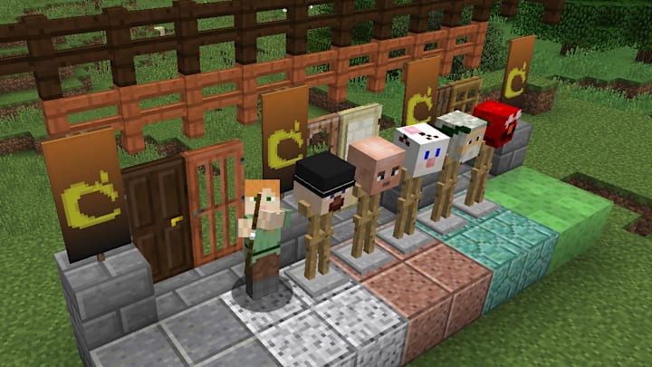 Alex aiming a bow at the camera next to a bunch of different stone types.