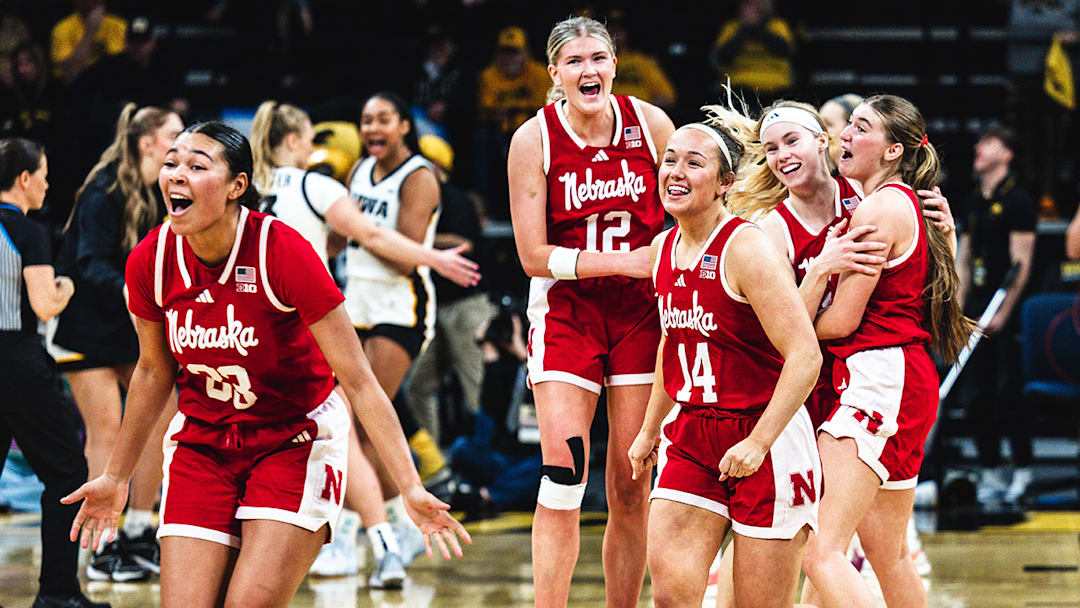 The Huskers celebrate their overtime win in Iowa City.
