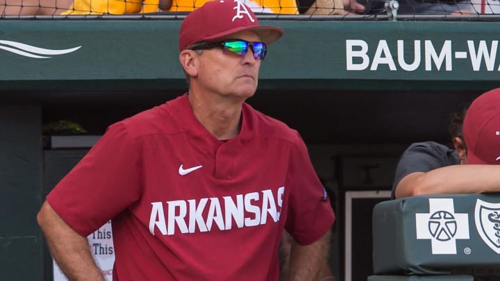 Arkansas Razorbacks head coach Dave Van Horn watches from the dugout during the game against the Mississippi Rebels at Baum-Walker Stadium.