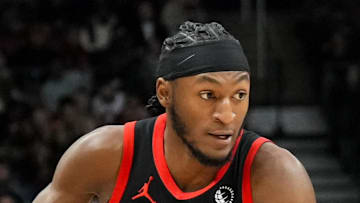 Toronto Raptors guard Immanuel Quickley moves the ball against the Miami Heat.