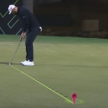 Jon Rahm lines up a putt at LIV Golf's Riyadh event.