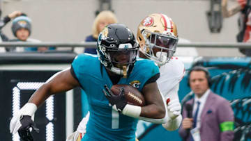 Nov 12, 2023; Jacksonville, Florida, USA; Jacksonville Jaguars running back Travis Etienne Jr. (1) runs with the ball against San Francisco 49ers during the second quarter at EverBank Stadium. Mandatory Credit: Morgan Tencza-Imagn Images