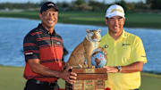 Tournament host Tiger Woods with the victory, Matsuyama.