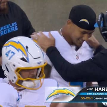 Los Angeles Chargers coach Jim Harbaugh hypes up quarterback Trey Lance during the annual Hall of Fame game in the NFL preseason.