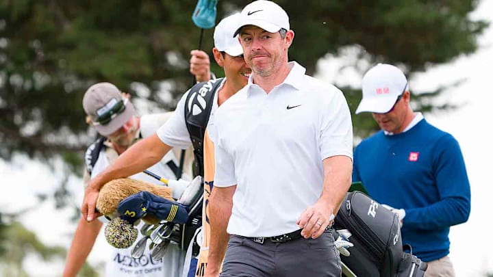 Rory McIlroy overcame a bizarre whiffed shot in Round 2 to make the cut in Australia.
