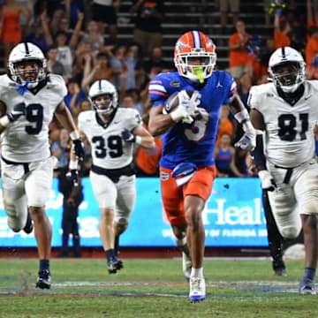 Florida Gators wide receiver Tre Wilson running away from the Samford defense.