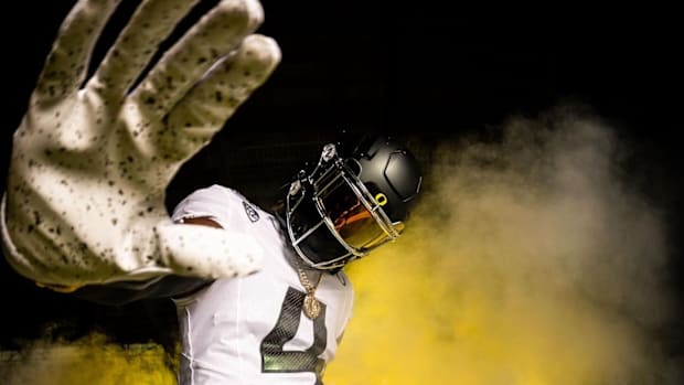 Oregon football commit Dallas Wilson wears a Ducks uniform during his visit to Eugene.