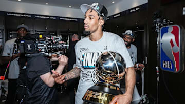 Former Gamecock star A.J. Lawson is holding the Western Conference trophy after a win against the Minnesota Timberwolves on May 30th, 2024.