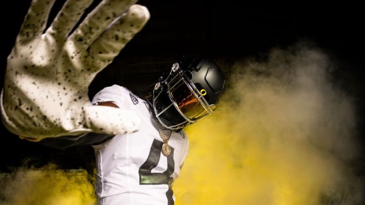 Oregon football commit Dallas Wilson wears a Ducks uniform during his visit to Eugene.