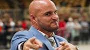Miami South Dade wrestling coach Victor Balmeceda has fun after winning the 2022 state championship.