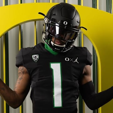 Oregon commit Dakorien Moore wears a black Ducks uniform during a visit.