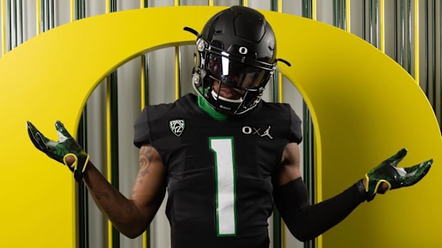 Oregon commit Dakorien Moore wears a black Ducks uniform during a visit.