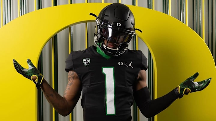 Oregon commit Dakorien Moore wears a black Ducks uniform during a visit.