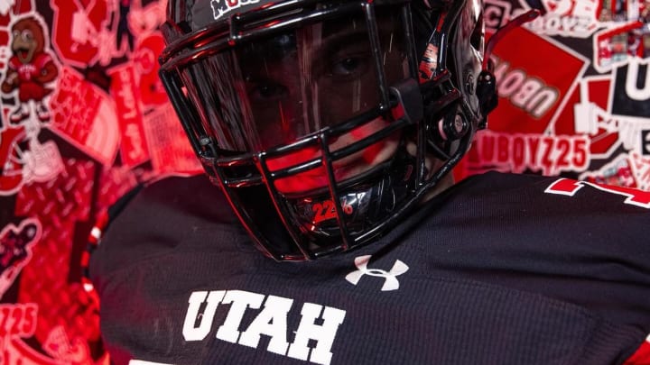 Four-star offensive tackle Aaron Dunn wearing a Utah uniform during a visit.