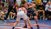 Bo Bassett sizes up Florida's Charlie Desena in the 150-pound Super 32 final. Bassett won 13-4 to capture his fourth consecutive Super 32 title.