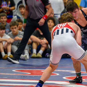 Bo Bassett sizes up Florida's Charlie Desena in the 150-pound Super 32 final. Bassett won 13-4 to capture his fourth consecutive Super 32 title.