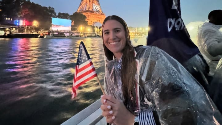 Former Oregon Duck Sabrina Ionescu rides a boat during the parade of nations up the River Seine for the Opening Ceremony of the Paris Olympics.