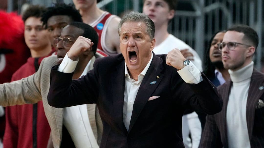 University of Arkansas coach John Calipari egging his players on against the Kansas Jayhawks in the first round of the NCAA tournament in Providence, RI.