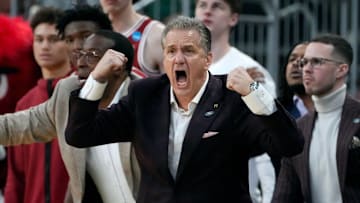 University of Arkansas coach John Calipari egging his players on against the Kansas Jayhawks in the first round of the NCAA tournament in Providence, RI.