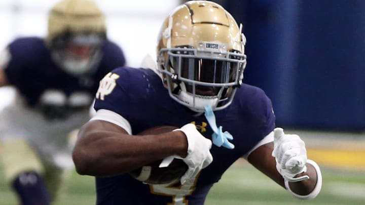 Notre Dame running back Jeremiyah Loves runs with the ball after making a catch