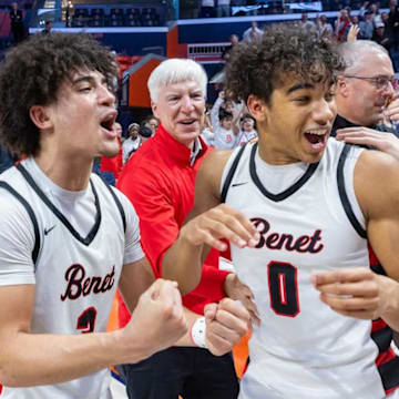Benet's Jayden Wright (left) and Blake Fagbemi celebrate the Redwings' 55-54 win over Warren in the IHSA Class 4A state championship game on March 15 in Champaign.