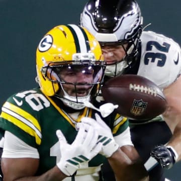 Green Bay Packers cornerback Bo Melton (16) drops a pass against Philadelphia Eagles safety Reed Blankenship.