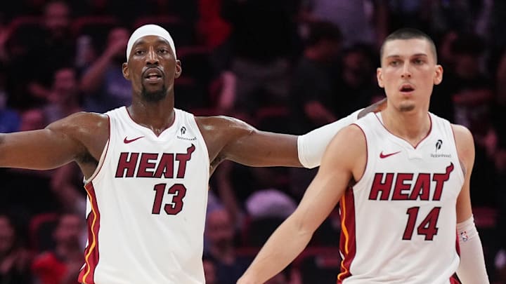 Dec 1, 2025; Miami, Florida, USA; Miami Heat center Bam Adebayo (13), guard Norman Powell (24) and guard Tyler Herro (14) get back on defense against the Los Angeles Clippers during the second half at Kaseya Center. Mandatory Credit: Jim Rassol-Imagn Images