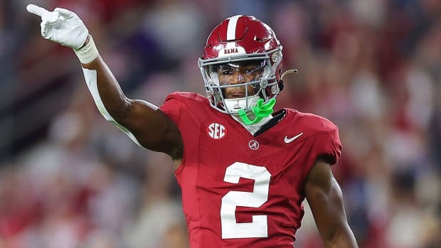 Alabama Crimson Tide football player celebrates a good play.