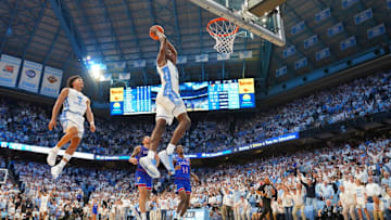 Nov 7, 2025; Chapel Hill, North Carolina, USA; North Carolina Tar Heels forward Caleb Wilson (8) dunks the ball as guard Seth Trimble (7) is in the background near the end of the second half at Dean E. Smith Center. Mandatory Credit: Bob Donnan-Imagn Images