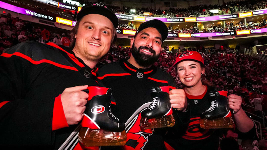 Carolina Hurricanes fans holding beer skates