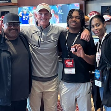 Jaxsen Stokes and family with Oklahoma coach Brent Venables