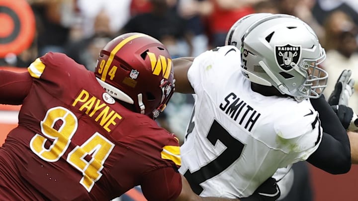 Sep 21, 2025; Landover, Maryland, USA; Las Vegas Raiders quarterback Geno Smith (7) attempts to avoid a sack by Washington Commanders nose tackle Daron Payne (94) during the second quarter at Northwest Stadium. Mandatory Credit: Geoff Burke-Imagn Images Sep 21, 2025; Landover, Maryland, USA; Las Vegas Raiders quarterback Geno Smith (7) attempts to avoid a sack by Washington Commanders nose tackle Daron Payne (94) during the second quarter at Northwest Stadium. Mandatory Credit: Geoff Burke-Imagn Images