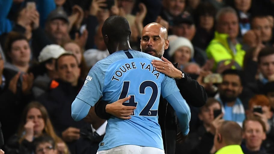 Yaya Toure hugging Pep Guardiola.