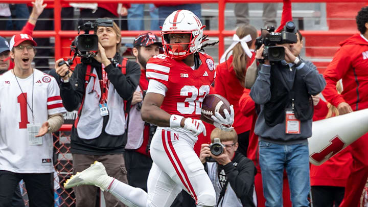 Kenneth Williams peeks back during his 95-yard kickoff return .
