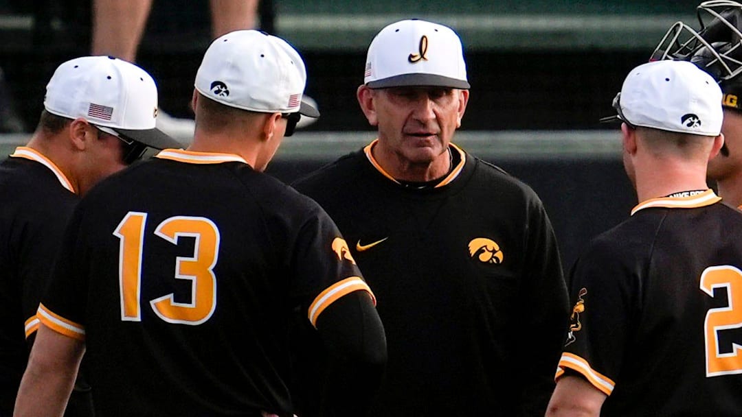 Iowa baseball head coach Rick Heller talks to infielders during a pitching change against Bradley April 16, 2025 at Duane Banks Field in Iowa City, Iowa.