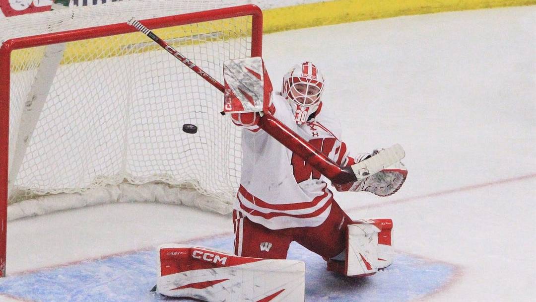 Wisconsin goaltender Ava McNaughton knocks away a shot from Bemidji State during a first-round WCHA playoff game Feb. 27, 2026 at LaBahn Arena in Madison, Wis. Wisconsin won, 7-0.