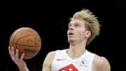 Toronto Raptors guard Gradey Dick drives to the basket against Brooklyn Nets forward Ziaire Williams.