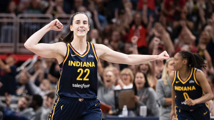 Caitlin Clark of the Indiana Fever celebrates in the second half of a game against the Seattle Storm at Gainbridge Fieldhouse on August 18, 2024 in Indianapolis, Indiana. 