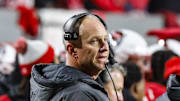 Nov 29, 2025; Raleigh, North Carolina, USA;  NC State Wolfpack head coach Dave Doeren reacts during the first half of the game against North Carolina Tar Heels at Carter-Finley Stadium.  Mandatory Credit: Jaylynn Nash-Imagn Images