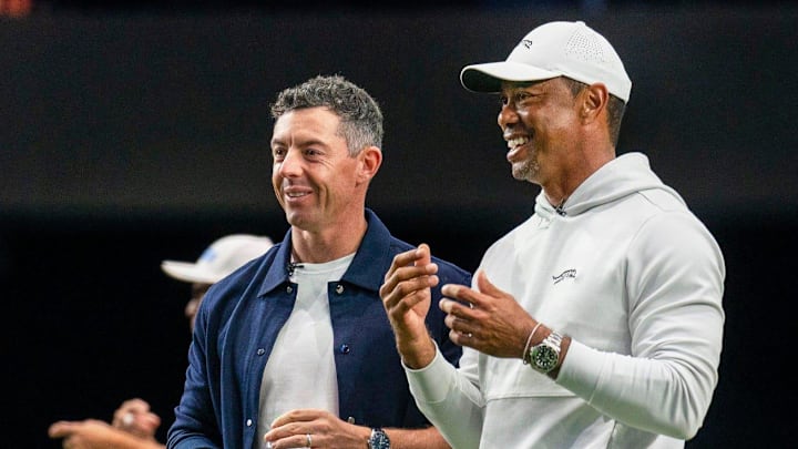 Rory McIlroy and Tiger Woods watch golfers warm up for TGL's inaugural match at SoFi Center in Palm Beach Gardens, Florida. Rory McIlroy and Tiger Woods watch golfers warm up for TGL's inaugural match at SoFi Center in Palm Beach Gardens, Florida.