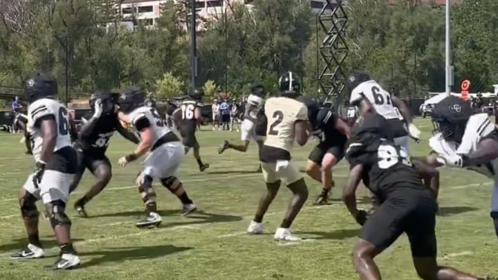 Shedeur Sanders steps up in the pocket during practice. 