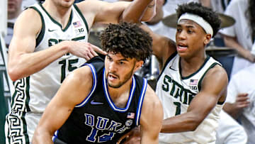 Michigan State's Carson Cooper, left, and Jeremy Fears Jr., right, pressure Duke's Cameron Boozer during the second half on Saturday, Dec. 6, 2025, at the Breslin Center in East Lansing.